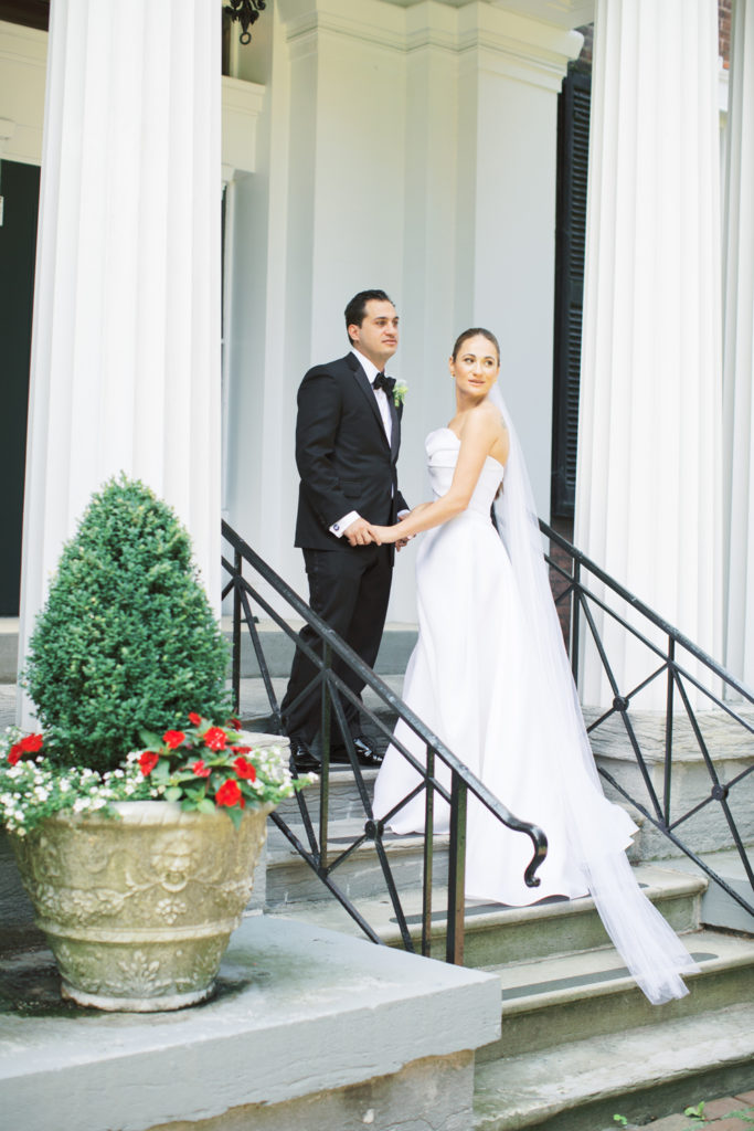 bride and groom on steps of Genesee Valley club | Mary Dougherty