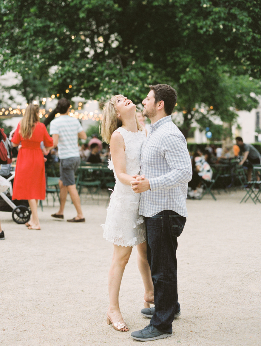 couple dancing and laughing in Madison Square Park by Mary Dougherty