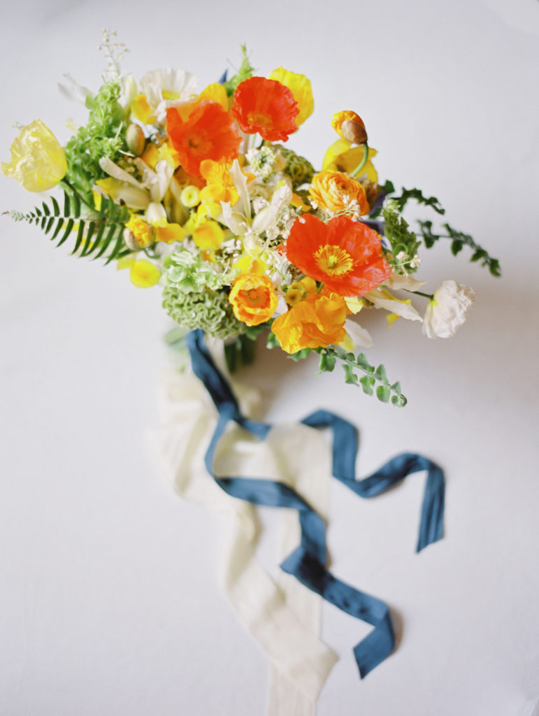 wedding bouquet with icelandic poppies and orange, red, yellow flowers and ribbon by Little Farmhouse Flowers for Lake Placid Wedding | Mary Dougherty