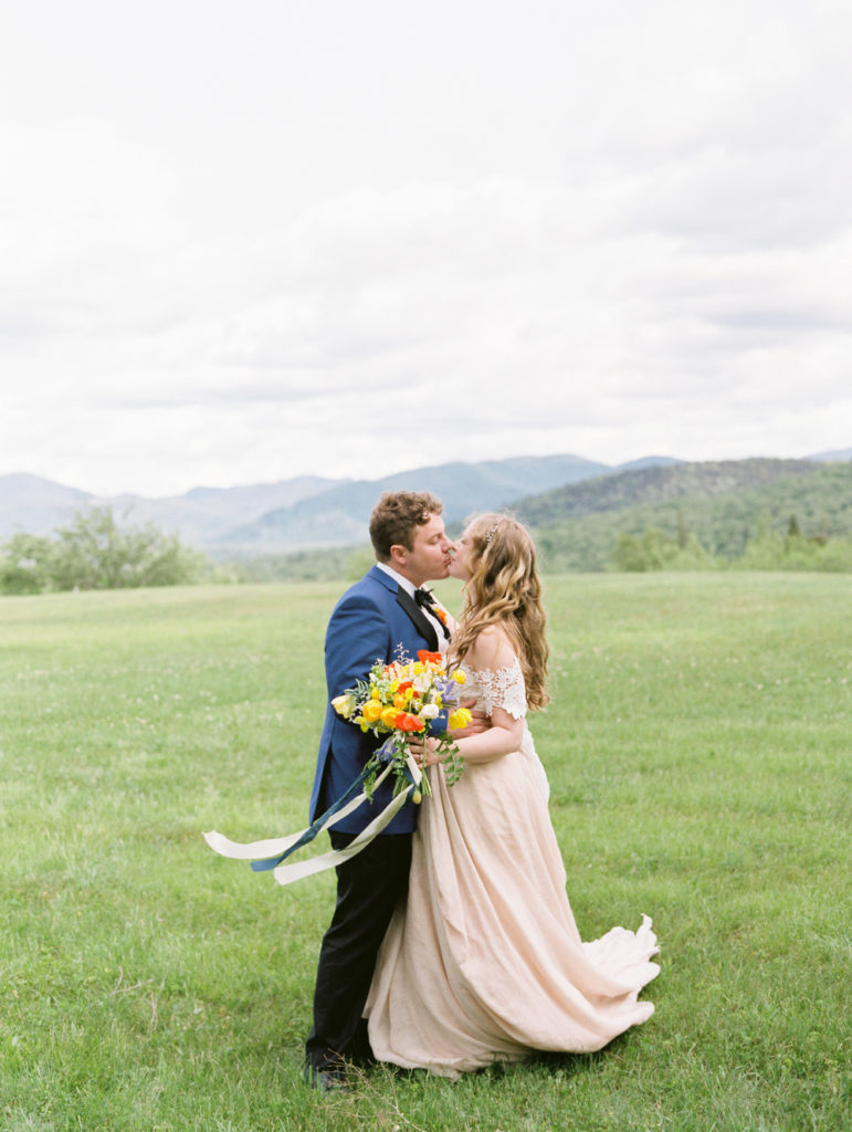 Bride and Groom share a kiss at their Whiteface Lodge Wedding