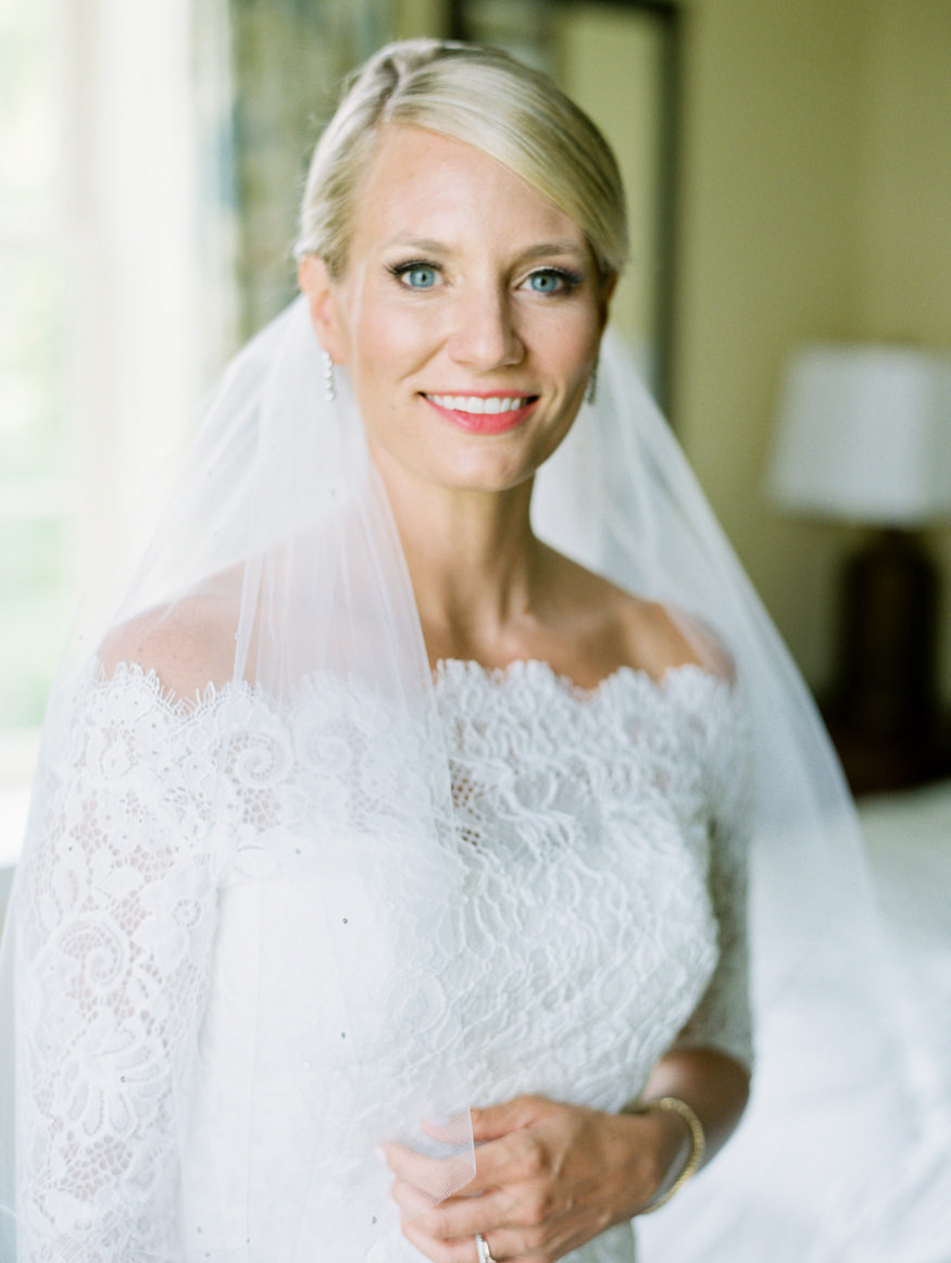 bride dressed in lace with veil at the Otesaga resort hotel in Cooperstown | Mary Dougherty