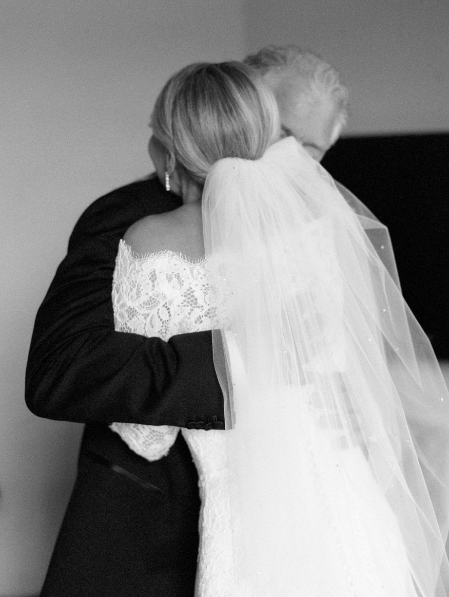 bride hugging dad after dad first look on wedding day | Mary Dougherty bw fine art film photographer