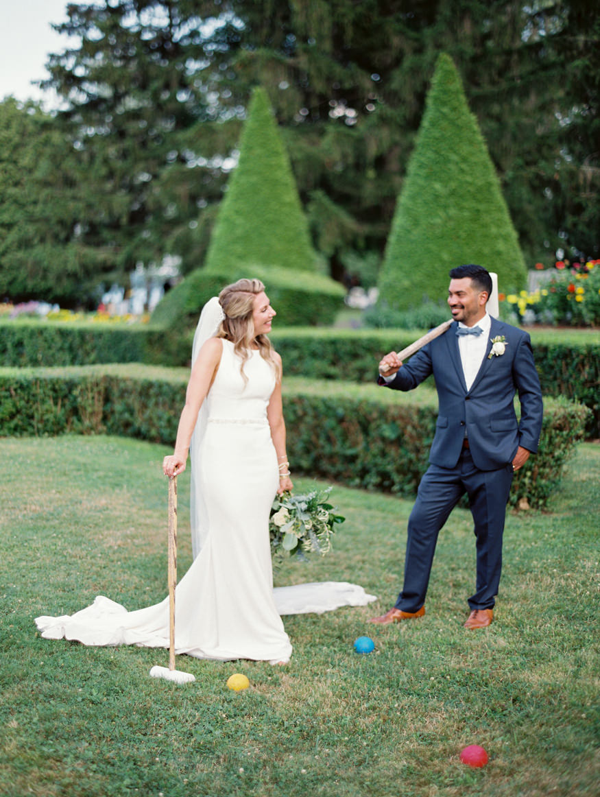 bride and groom playing croquet in garden at modern estate New York wedding | Mary Dougherty