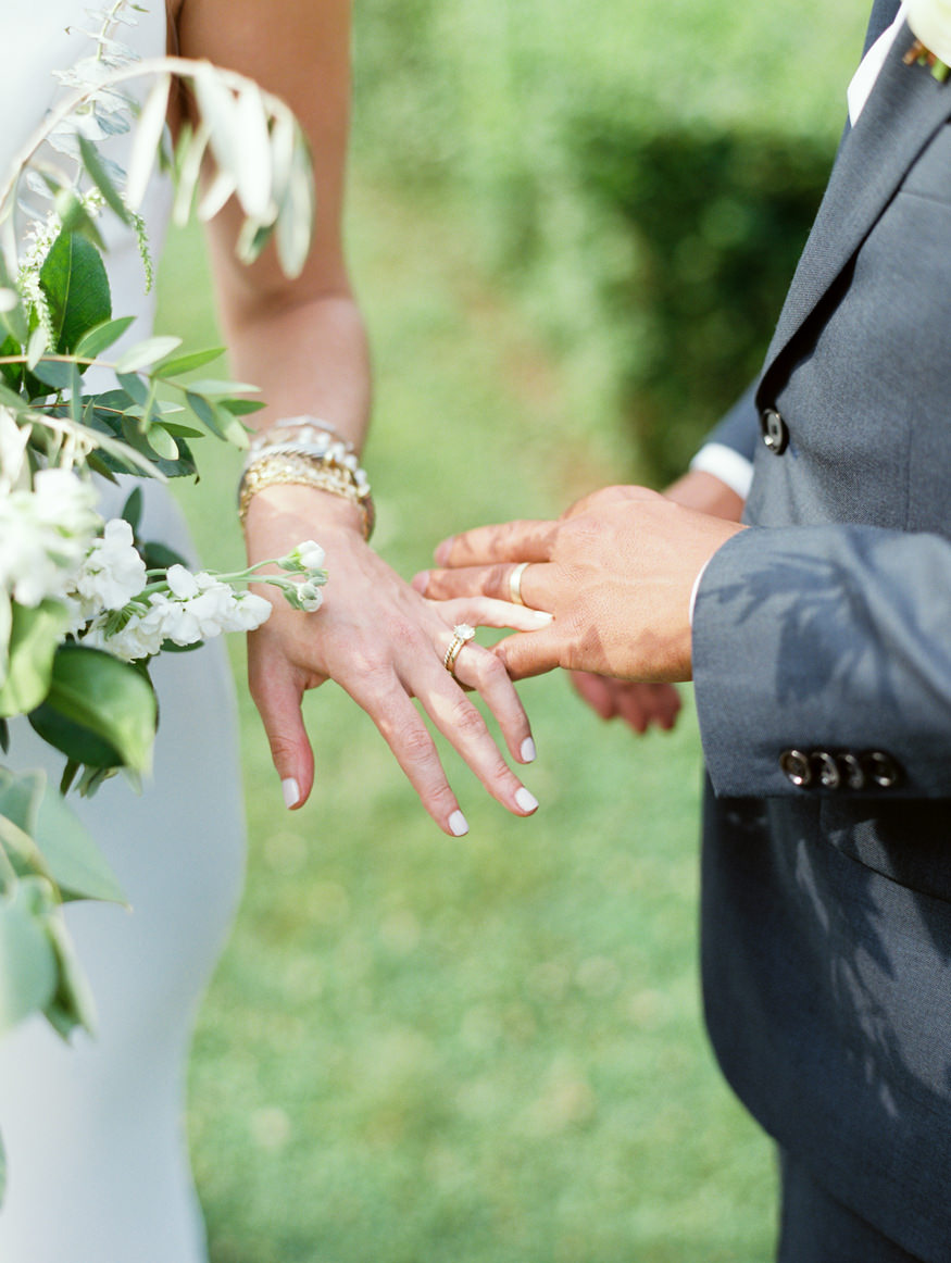 bride and groom hands look at rings Mary Dougherty