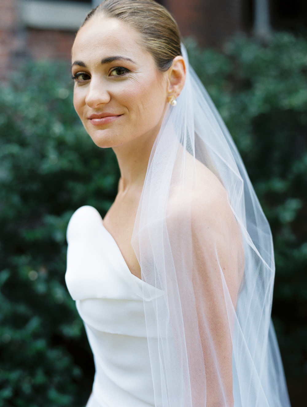 modern bride looks at camera for bridal portrait at Genesee Valley Club on wedding day | Mary Dougherty