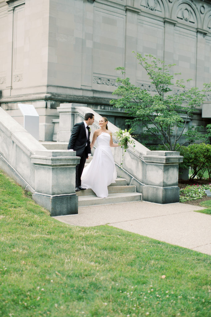 bride and groom walking at the Memorial Art Gallery in Rochester New York by Mary Dougherty