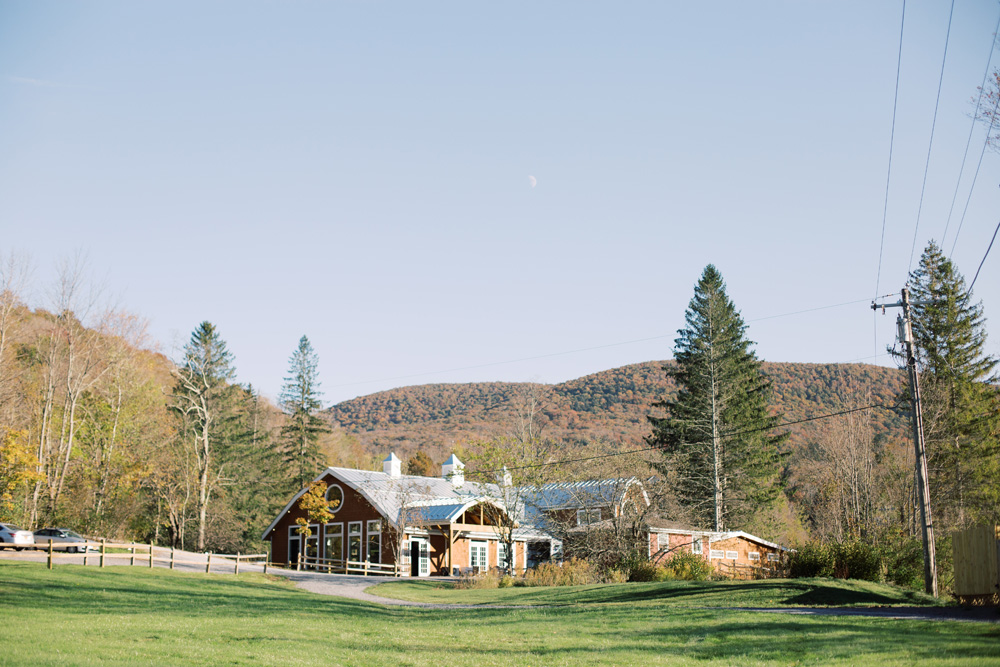 Full Moon Resort as seen from the lawn towards the ceremony space | Catskills Wedding Photographer Mary Dougherty