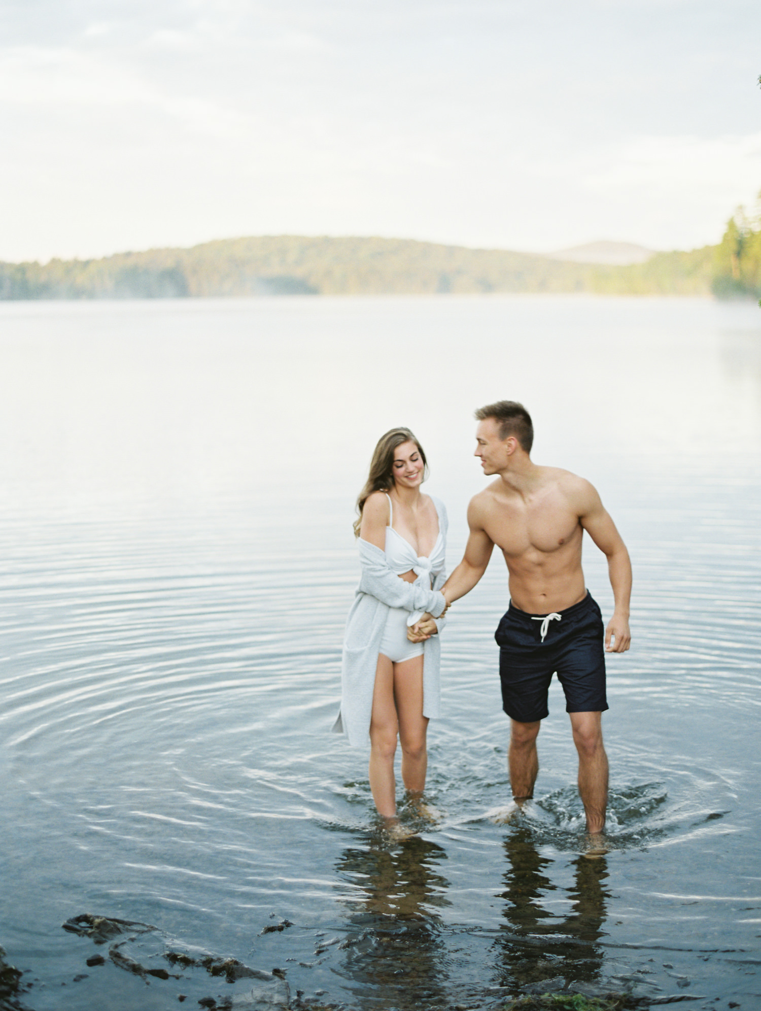 honeymoon couple walks out of lake in Adirondacks Old forge New York  Mary Dougherty Photography