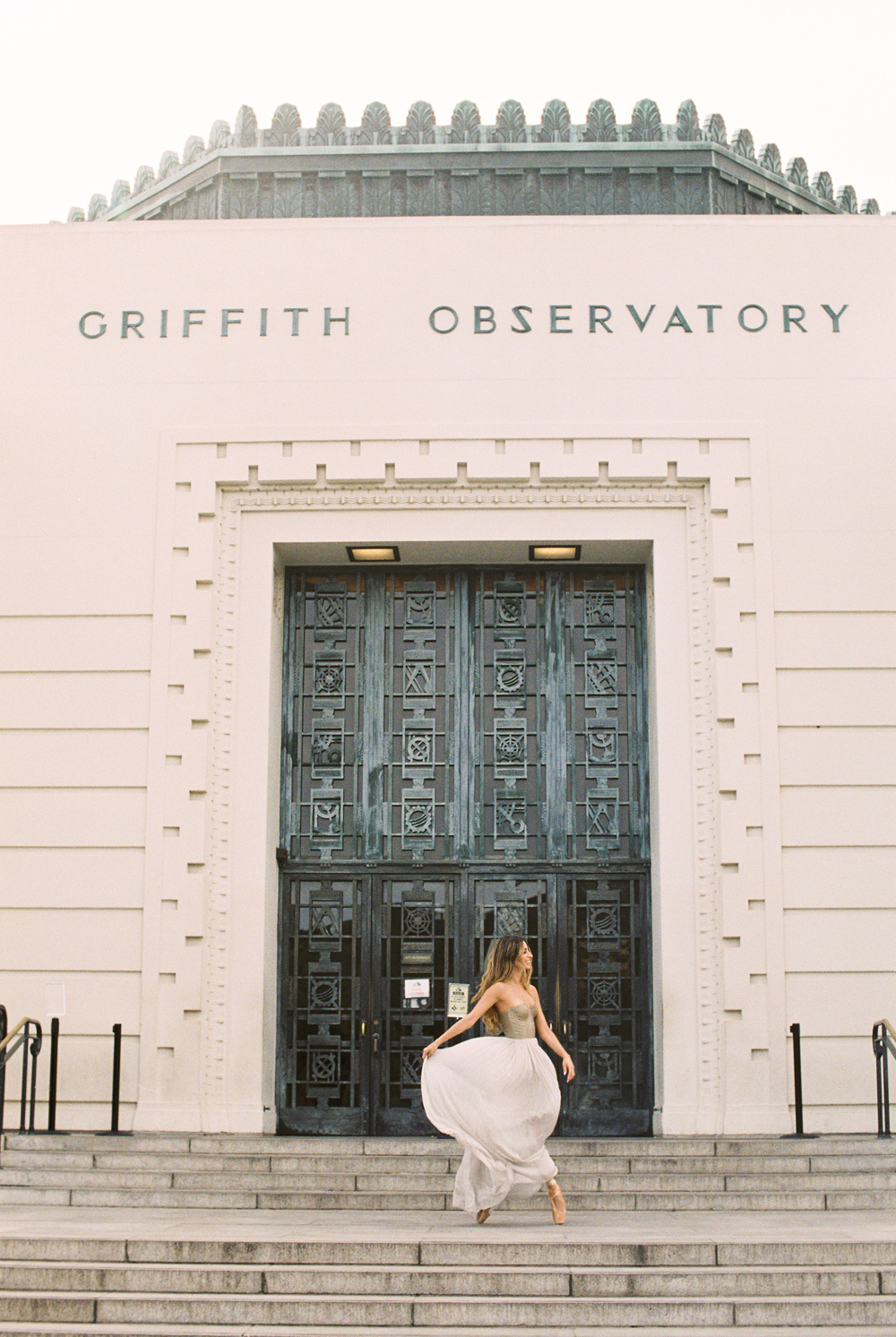 view of Griffith Observatory in Los Angeles with dancer Mariana Carrillo dancing in front Leanne Marshall dress photo by Mary Dougherty