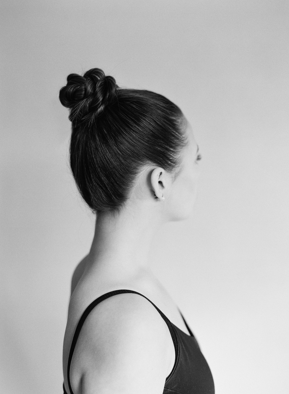 back of ballerina top knot bun for Katherine Elizabeth Salon brand editorial day to night makeup looks with Leanne Marshall dress by Mary Dougherty Photography