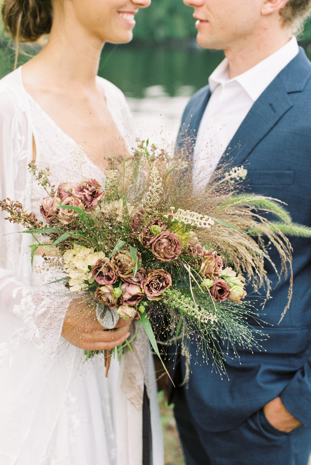 rustic modern bohemian wedding bouquet with dust mauve roses, wild grasses and foraged greens for Adirondack Island elopement by Mary Dougherty