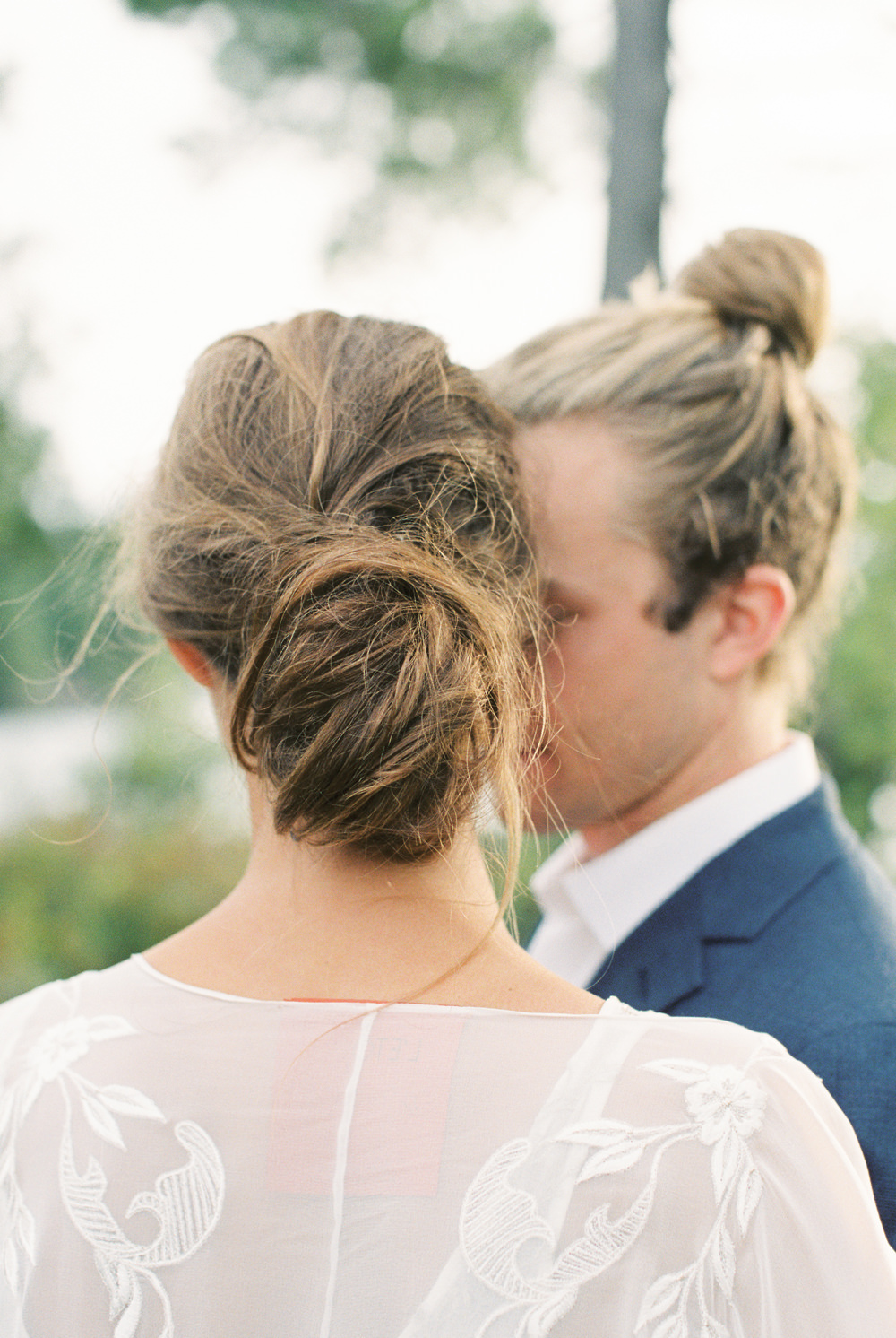 perfect messy bun low natural wedding hair and matching man bun for Adirondack island elopement by Mary Dougherty