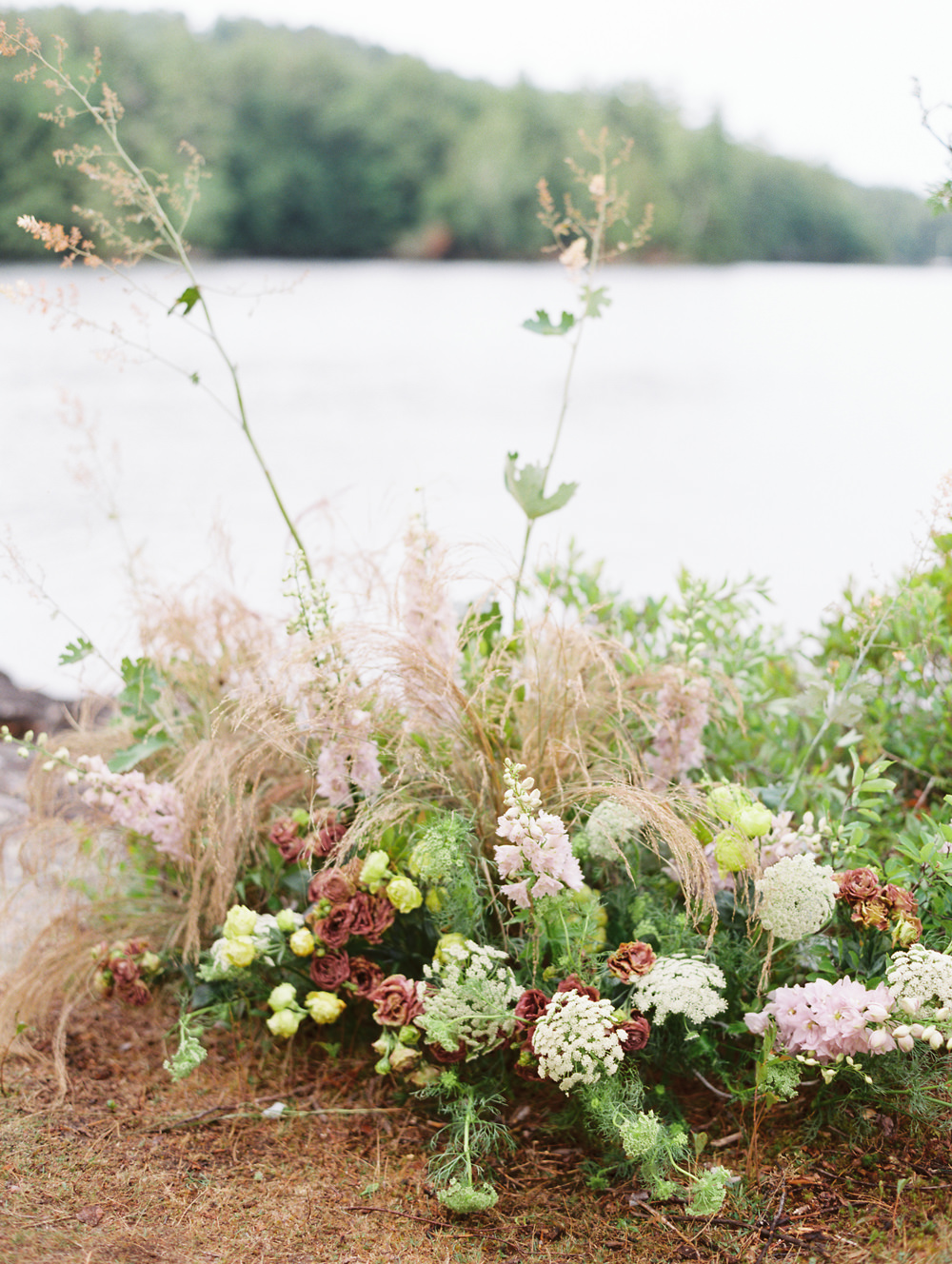floral install on island rustic greenery matching landscape by Fern Croft for Adirondack Wedding Workshop | Island Elopement by Mary Dougherty