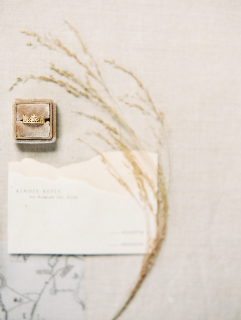 warm wheat cream colored wedding invitation with velvet ring box and crown lace wedding band | Adirondack Wedding Workshop | Mary Dougherty