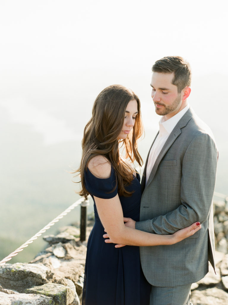 couple dressed for engagement photos on top of whiteface mountain in the Adirondacks by Mary Dougherty
