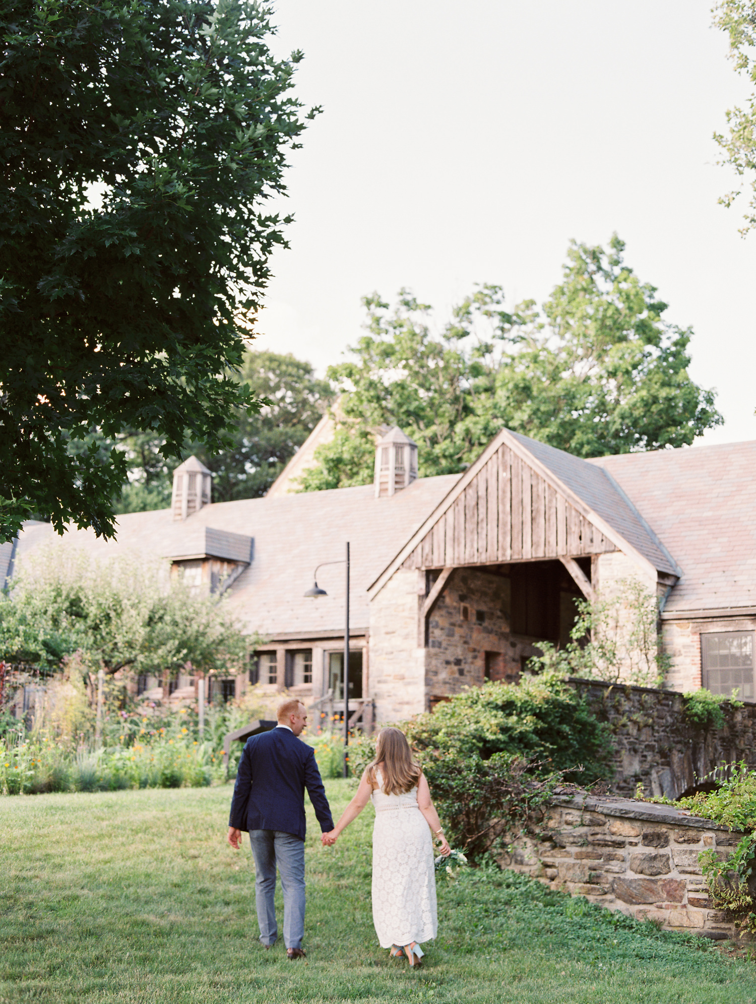 Bride and Groom walk to Blue Hill at Stone Barns NY for wedding celebration | photographed by Mary Dougherty 