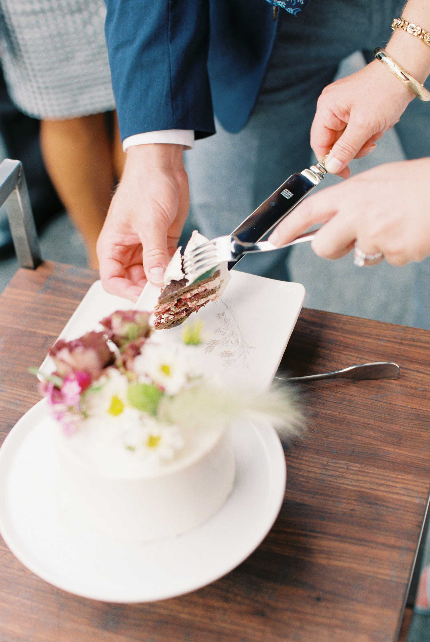 bride and groom cut wedding cake | photographed by Mary Dougherty 