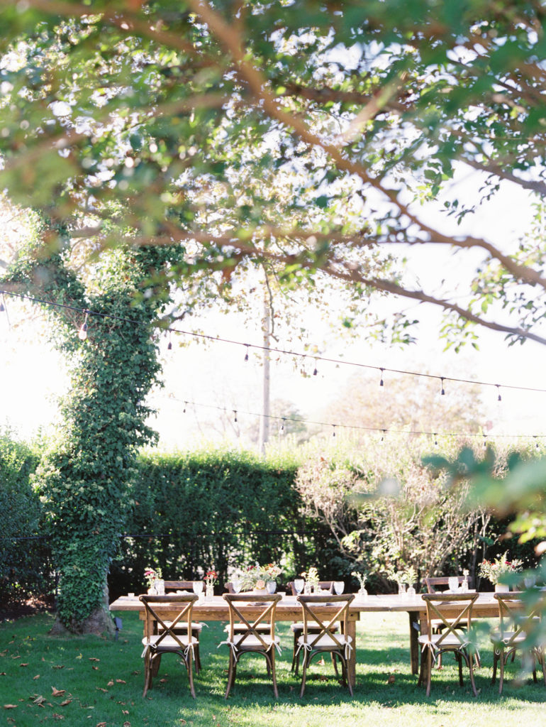 Farmhouse table set for backyard wedding in Sea Girt, New Jersey photographed by film photographer Mary Dougherty