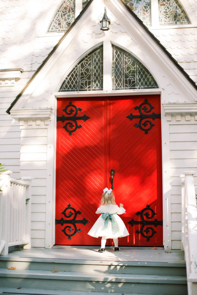A stunning red door welcomes wedding guests into the Hall of Christ at Chautauqua Institution