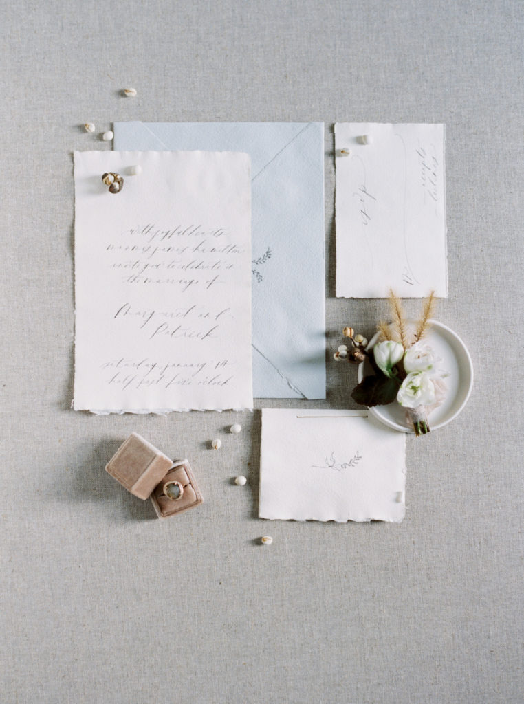 winter wedding invitation suite of grey, blue and cream with ring box and boutonnière photo by Mary Dougherty 