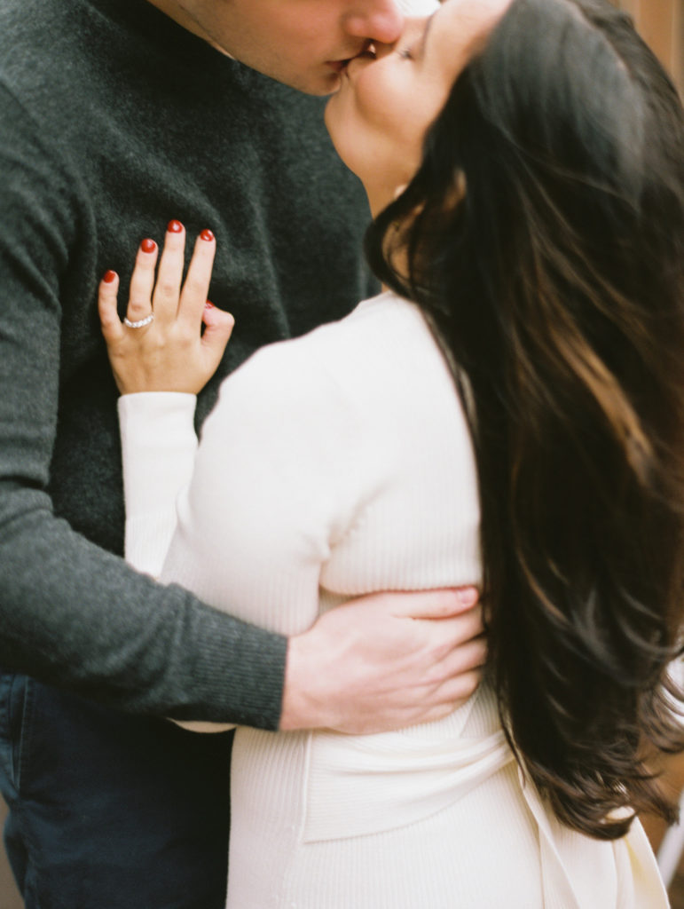 Woman and man embracing during their engagement photos at Gather Greene