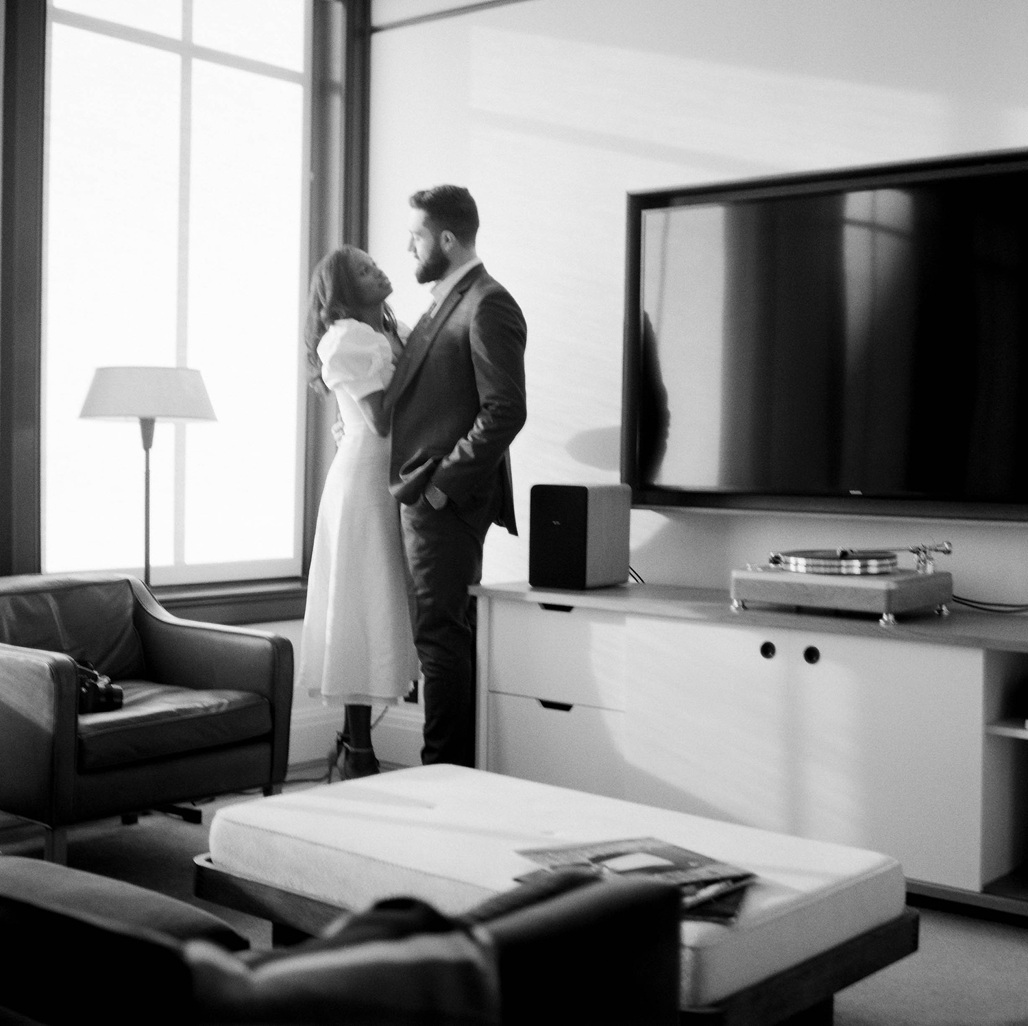 Black and white photo of engaged could inside the Shinola Hotel Detroit