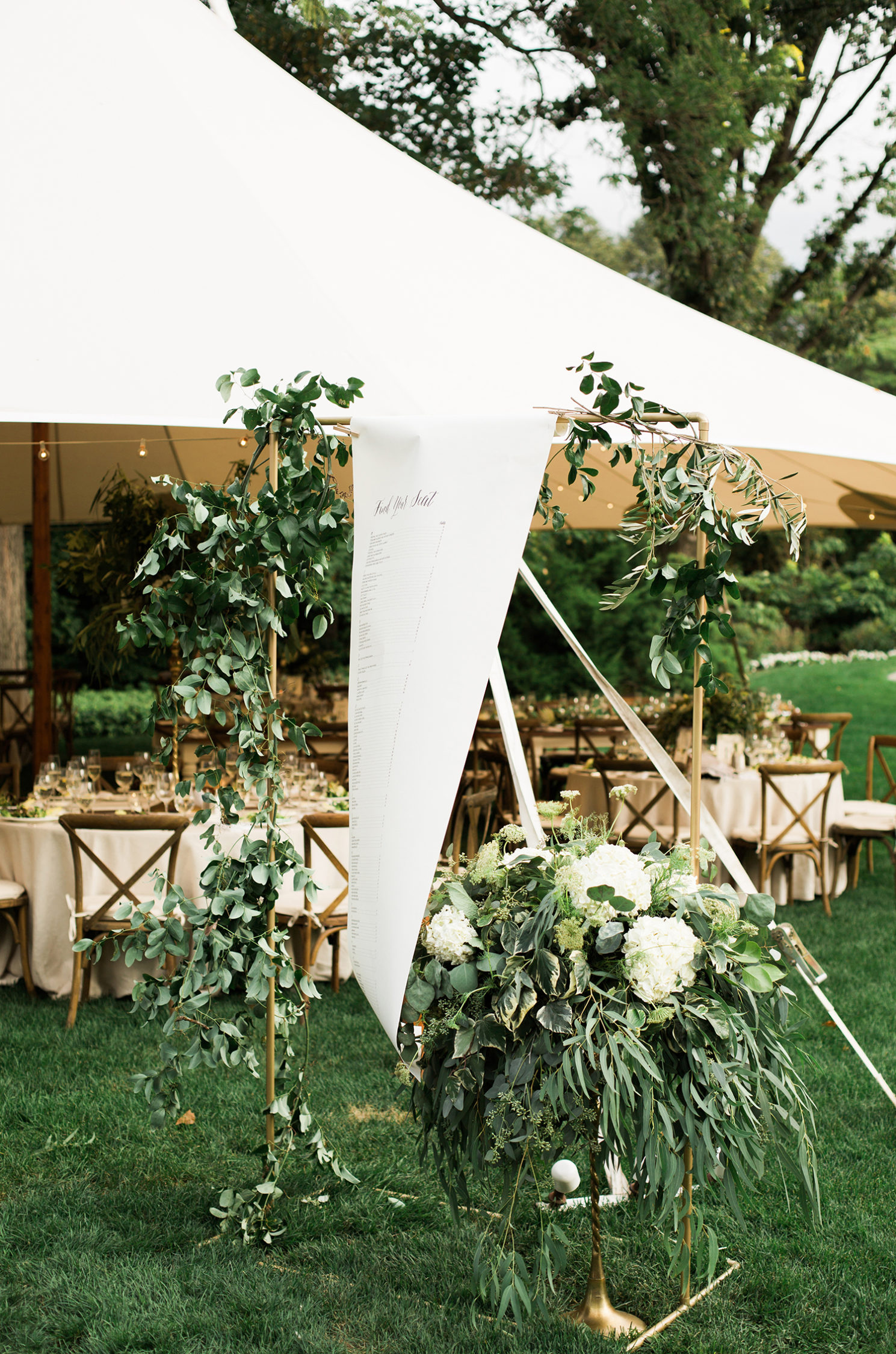 Outdoor wedding reception under tents and Living Roots Winery