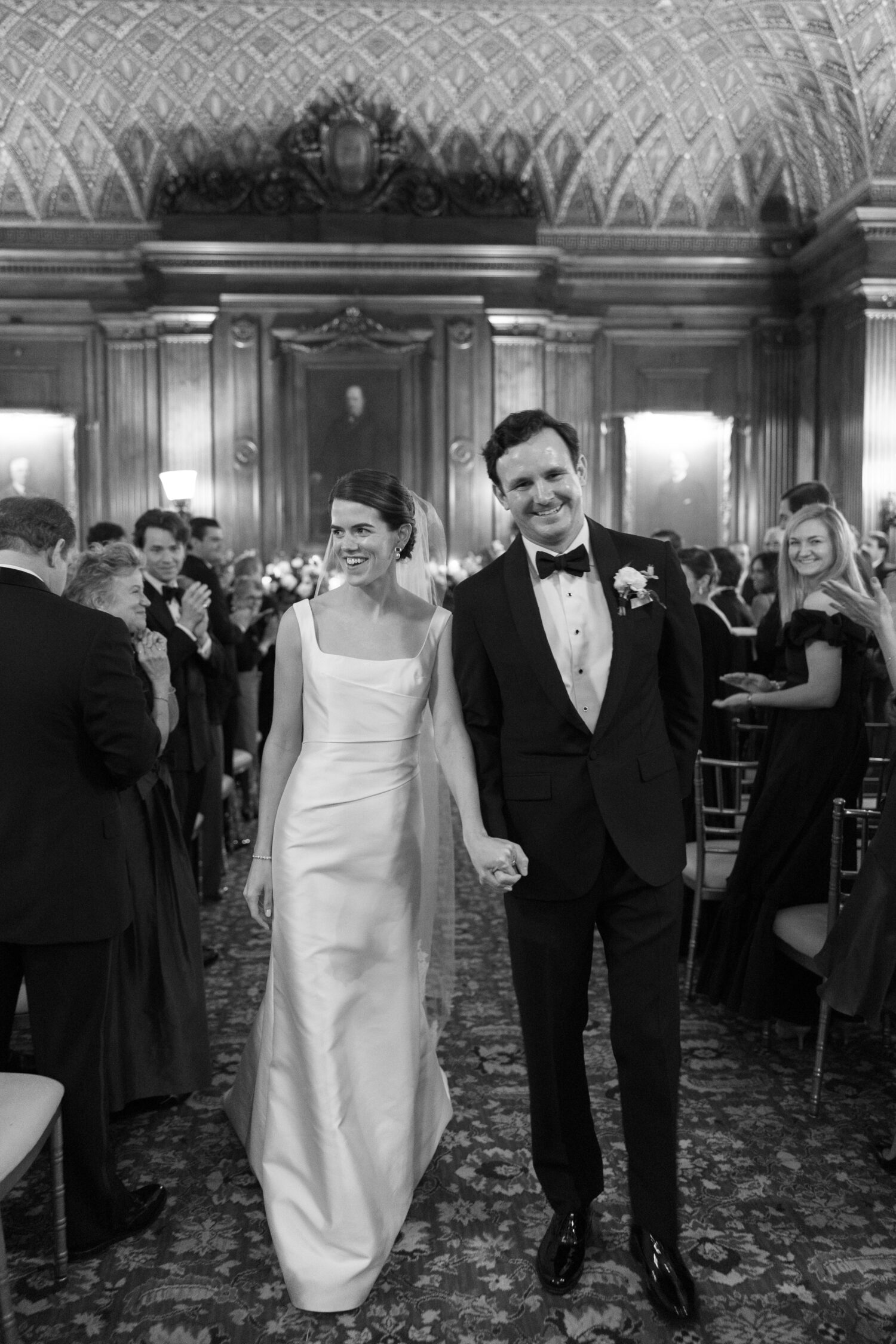 bride and groom recess from their ceremony at the University Club in midtown Manhattan photographed by Mary Dougherty